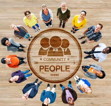 Community-first: people gathered around a shared table